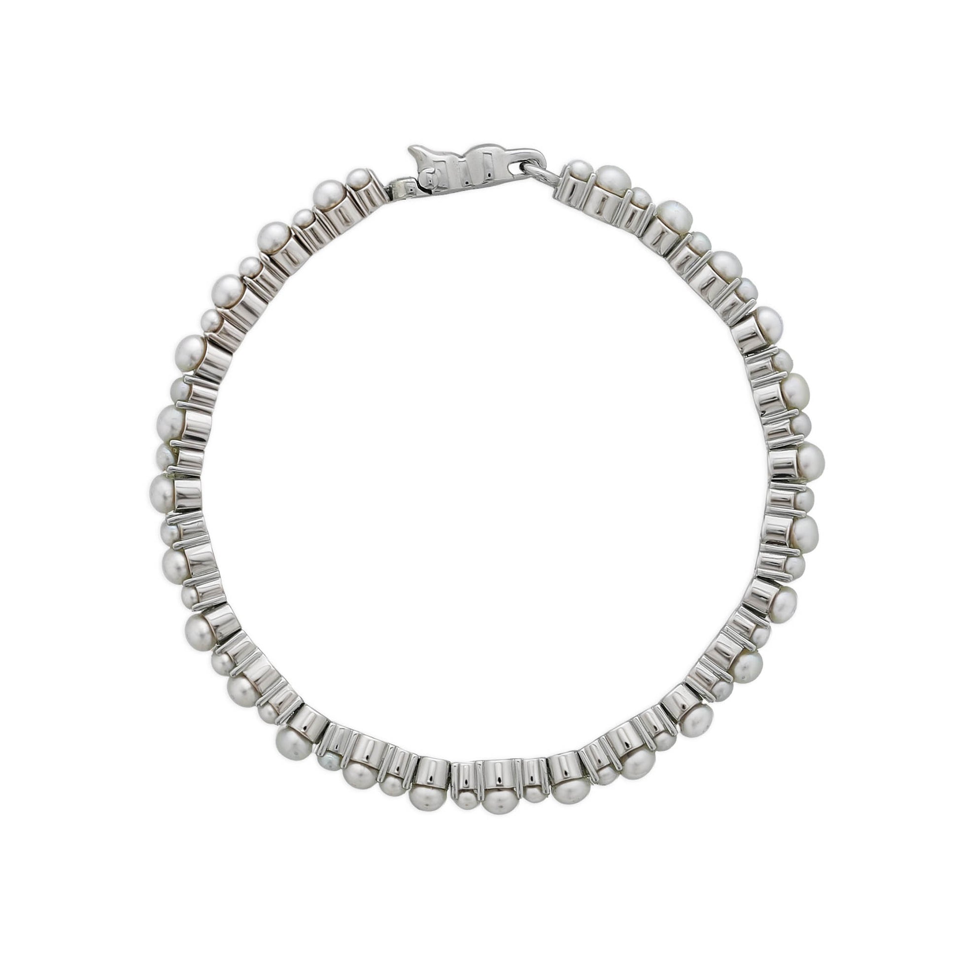 Top view of pearl tennis bracelet with white freshwater pearls set in sterling silver links & a secure clasp. Item No. 774057