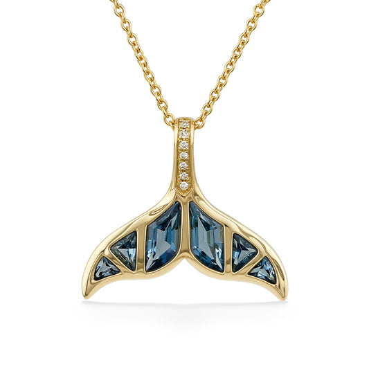 Whale tail shaped yellow gold pendant, inlaid with geometric blue topaz & accented by diamonds on the bale. Item No. 774147
