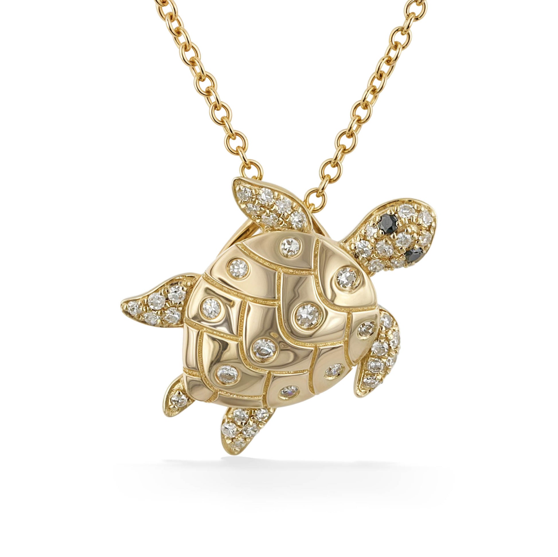 Charming gold sea turtle pendant encrusted with diamonds across its shell & flippers, hung on a gold chain. Item No. 774140