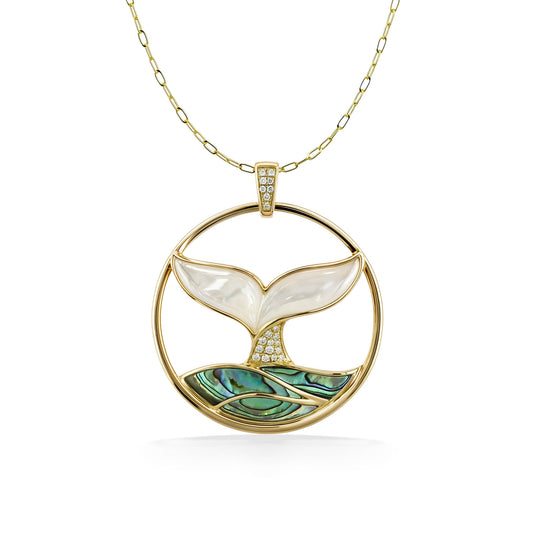 Whale tail pendant in a 14k gold circle featuring white mother of pearl & abalone inlay with diamond accents. Item No. 774203