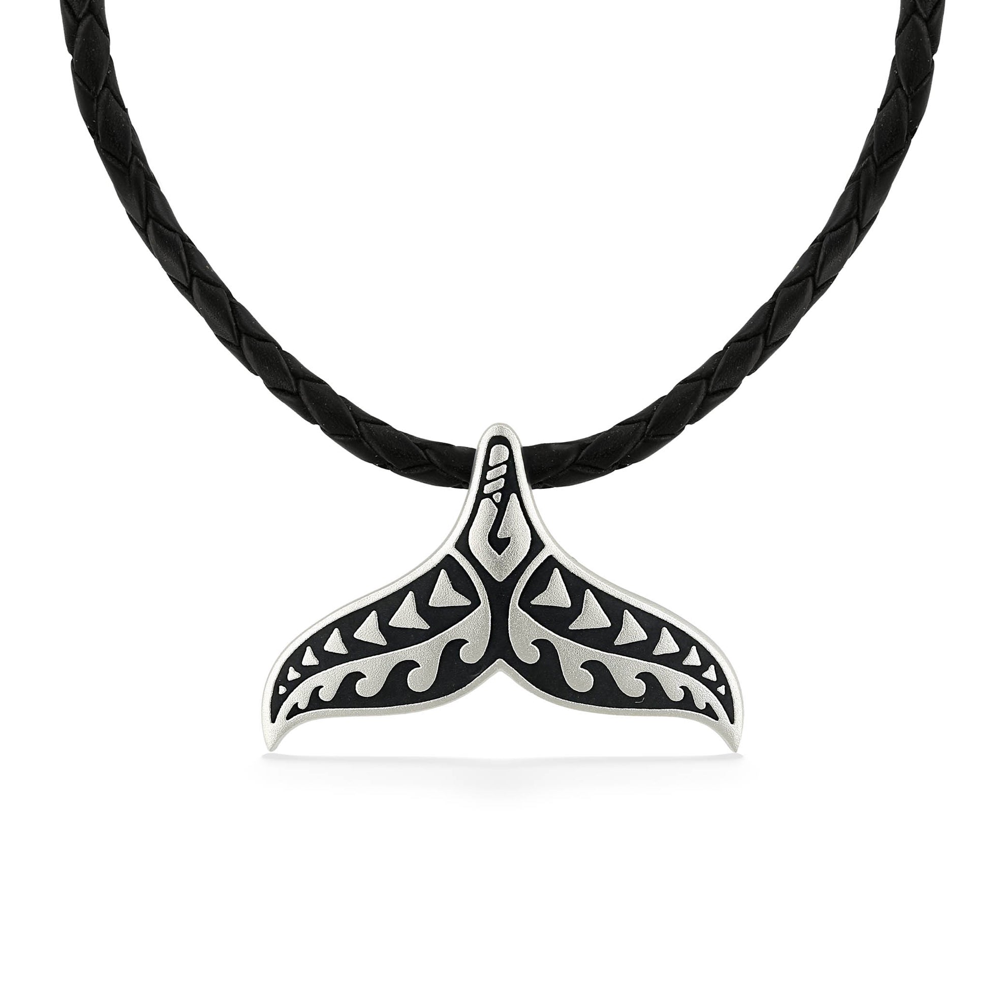 Tattoo Whale Tail pendant in sterling silver with black enamel pattern, hung on a black braided leather cord. Item No. 45267