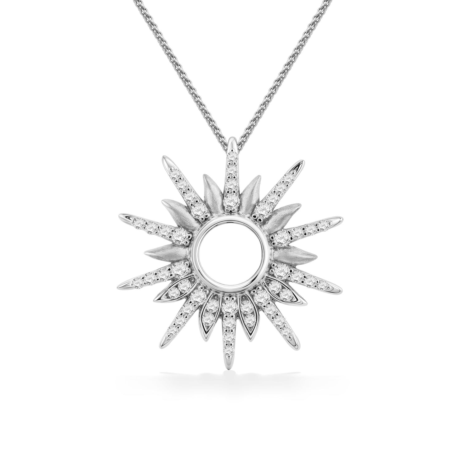 White gold diamond pendant in a radiant sunburst design, with alternating polished and pavé-set diamond rays. Item No. 45281