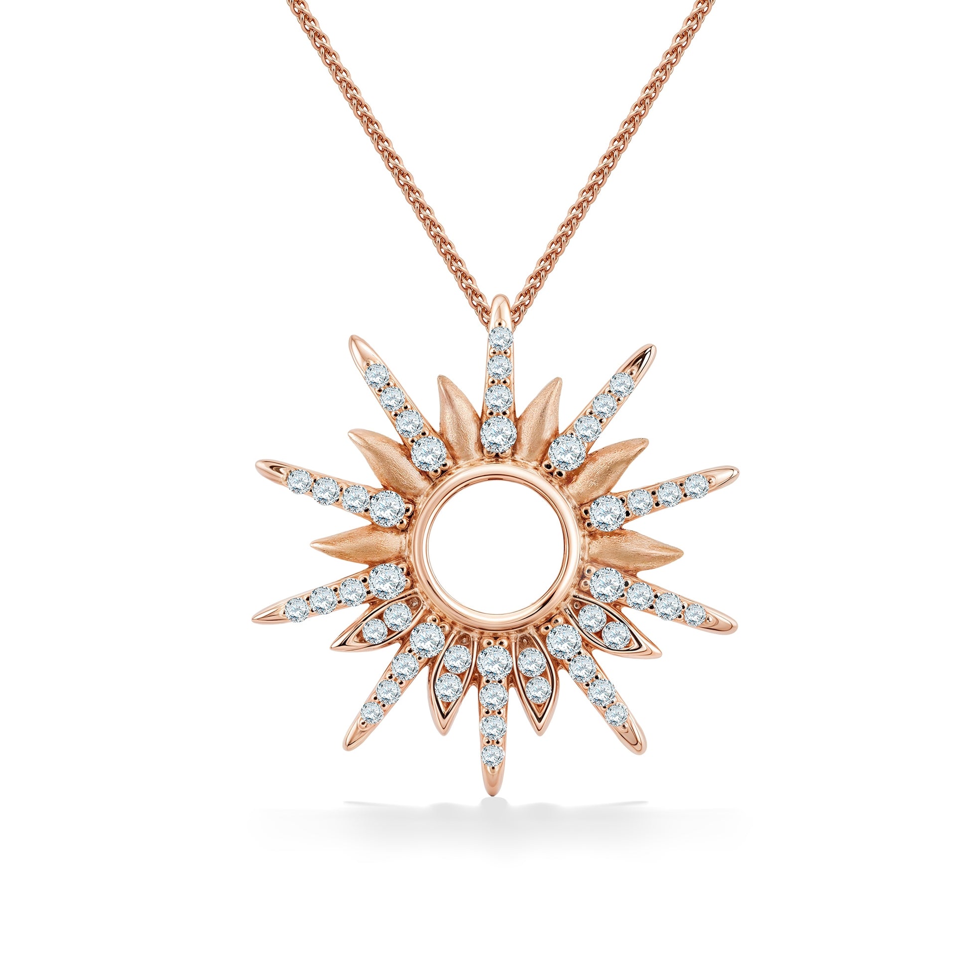A rose gold diamond sunburst pendant with an open circular center and bright white diamonds radiating outward. Item No. 45282