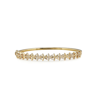 Flower hinged bangle made in 14K yellow gold with alternating diamond accented and matte flowers. Item No. 774274