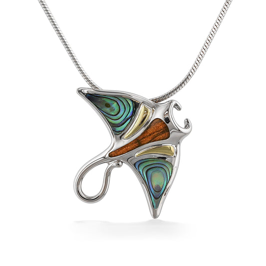 A manta ray pendant crafted from sterling silver with abalone shell, koa wood, and 18k gold inlays. Item No. 45290
