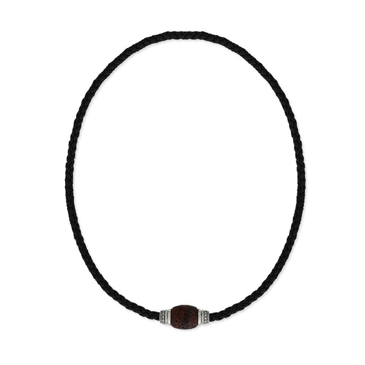 Brown braided leather cord necklace featuring carved red tiger eye bead accented with sterling silver pieces. Item No. 45291