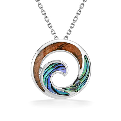 A swirling pendant combines koa wood and abalone shell inlay, framed in a sterling silver circle. Item No. 45349