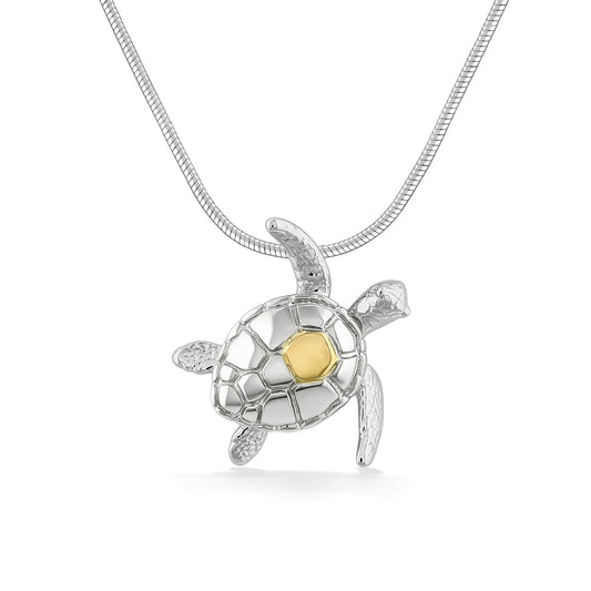 Sterling silver sea turtle pendant with a 14k yellow gold accent on the back of its shell. Item No. 45346