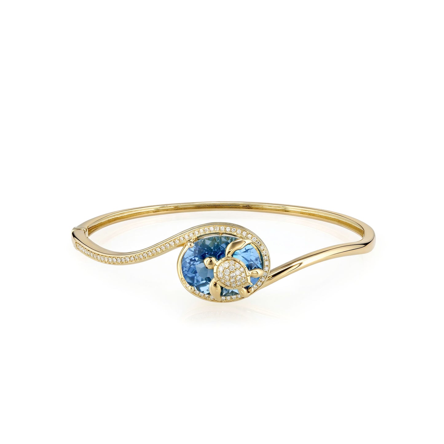Yellow gold hinged bangle with blue topaz turtle center & diamond accents flowing on a curved wave design. Item No. 774326