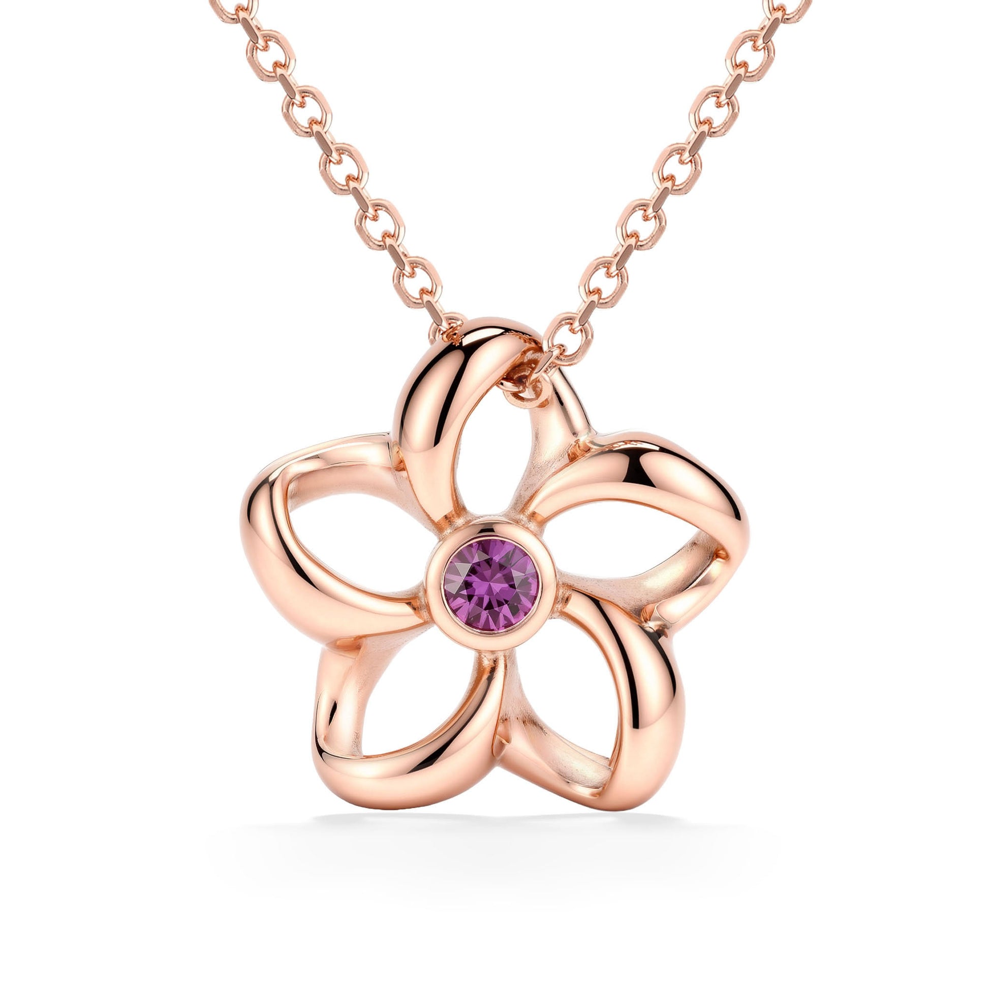 Floral open plumeria pendant made in 14K rose gold with a bezel-set pink sapphire center accent. Item No. 45372