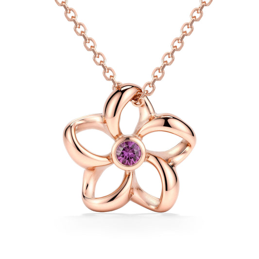 Floral open plumeria pendant made in 14K rose gold with a bezel-set pink sapphire center accent. Item No. 45372