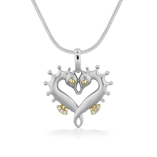 Sterling silver and 14K gold seahorse heart pendant with diamond accents and chain. Item No. 45375