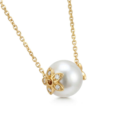 Side view highlighting the 14k yellow gold diamond floral setting detail of the akoya pearl slider necklace. Item No. 45412