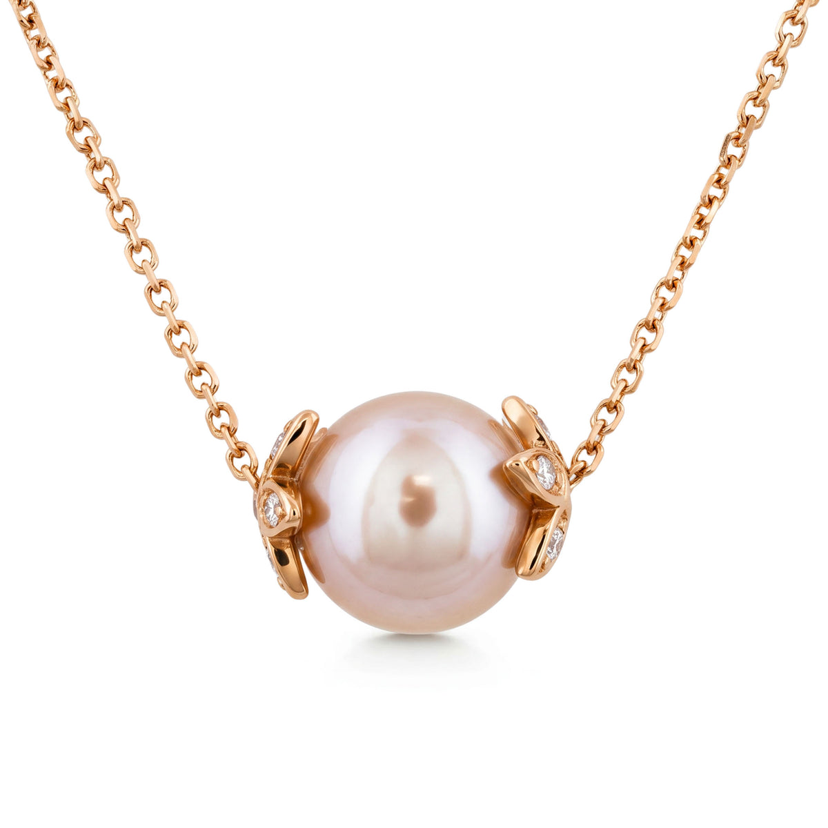 Round pink freshwater pearl slider necklace with 14k rose gold flower endcaps, accented with diamonds. Item No. 45414