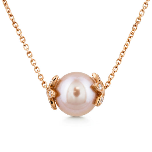 Round pink freshwater pearl slider necklace with 14k rose gold flower endcaps, accented with diamonds. Item No. 45414