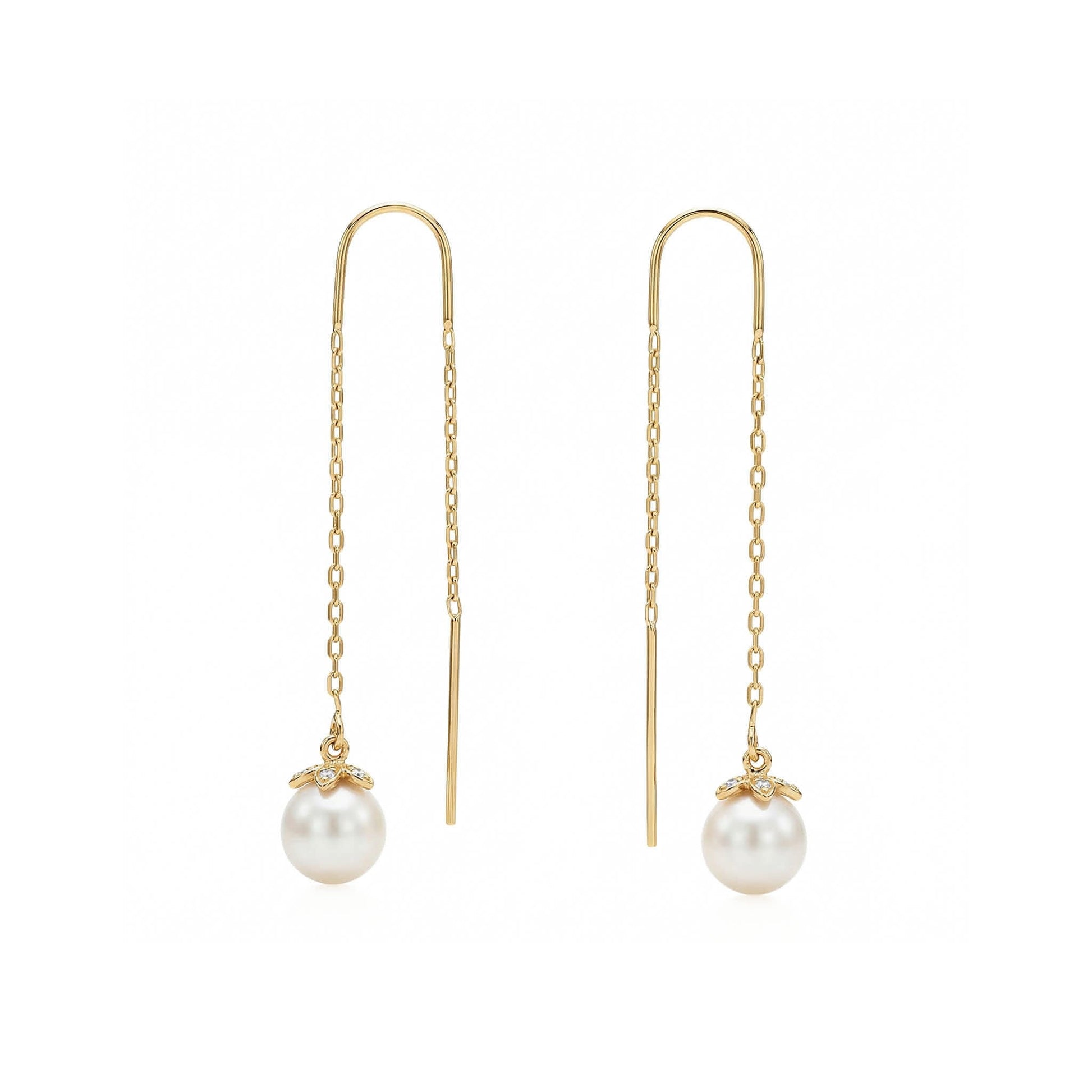 Yellow gold threader earrings with white akoya pearl and diamond set flower end caps. Item No. 45423