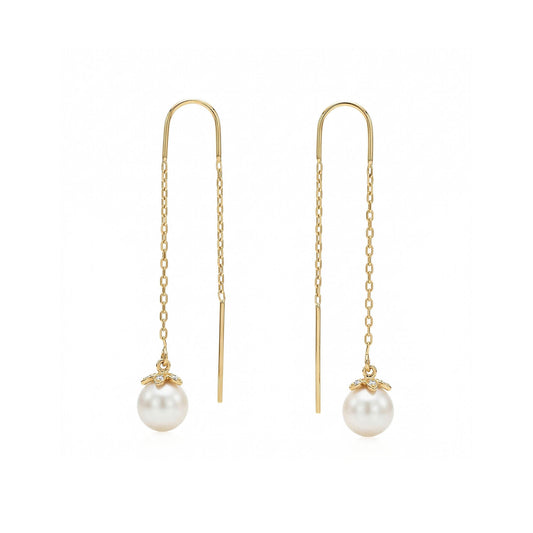 Yellow gold threader earrings with white akoya pearl and diamond set flower end caps. Item No. 45423
