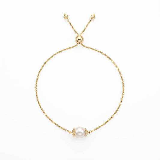 14K yellow gold flower bolo bracelet with a single 7mm white Akoya pearl and diamond accents. Item No. 45443