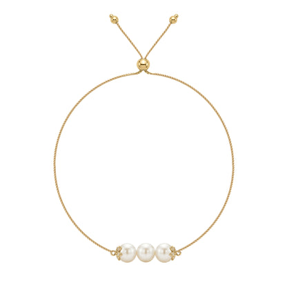 14K yellow gold flower bolo bracelet with three white Akoya pearls and diamond accents. Item No. 45446