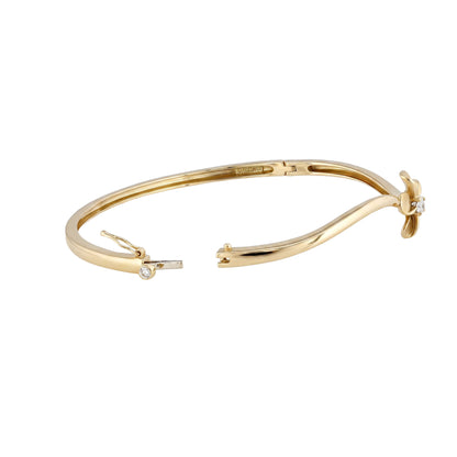 Opened hinge 14k yellow gold bangle, side view plumeria flower. Item No. 45461