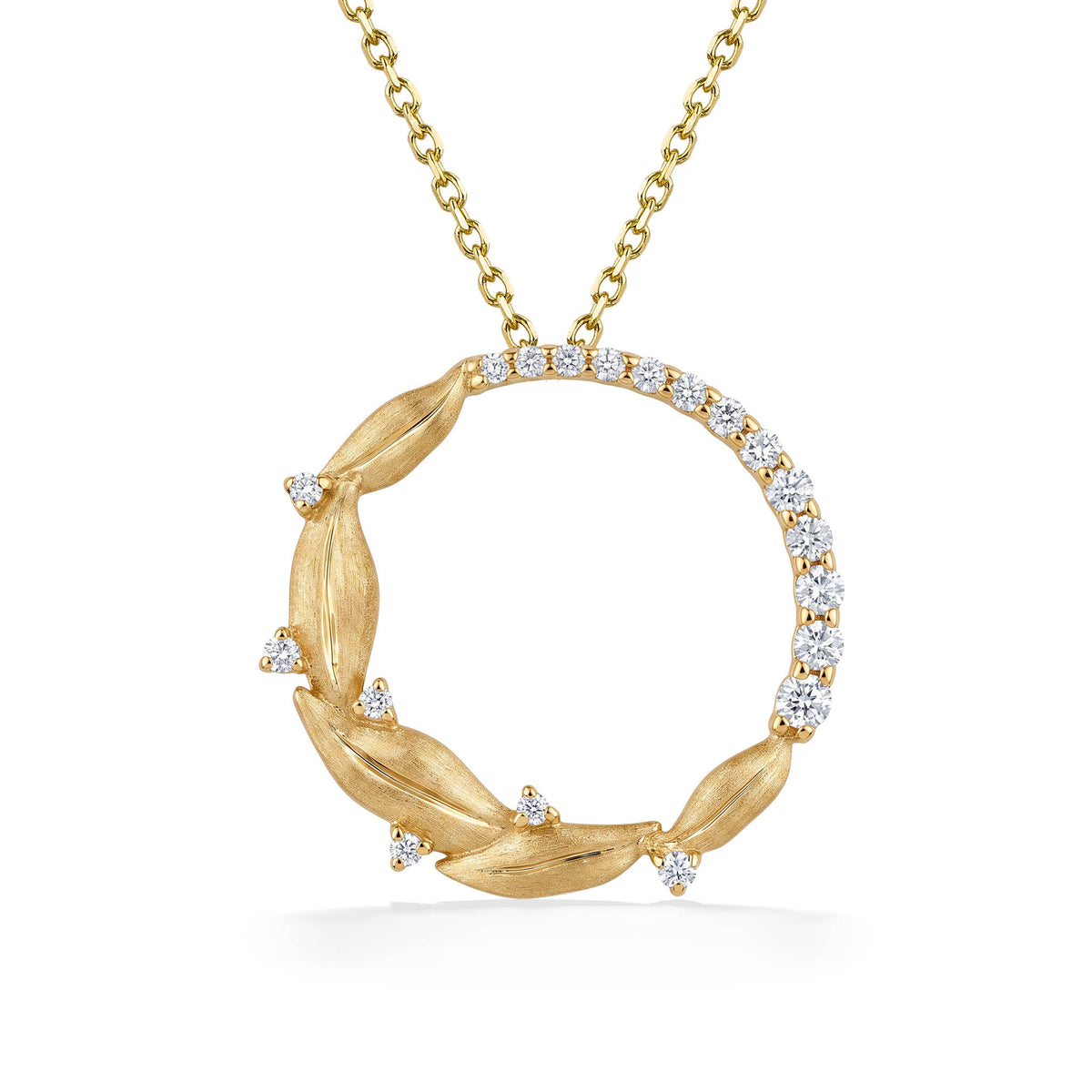 14k yellow gold circle shaped pendant with Maile leaves and diamond details. Item No. 45478 
