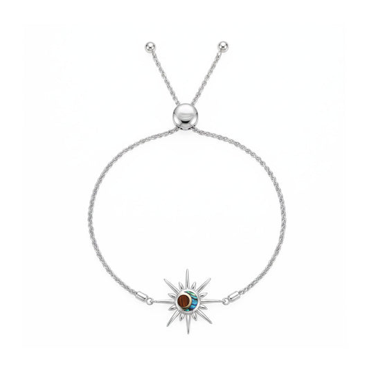 Overview of sterling silver and gold sun shape charm bolo bracelet with abalone and koa wood inside. Item No. 45504