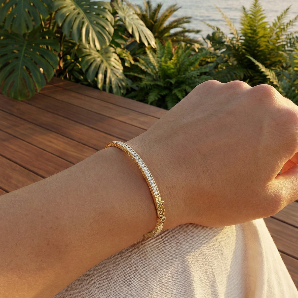 Close up of a hand wearing the Na Hoku Maile Scroll Diamond hinged bangle bracelet. Item No. 41779