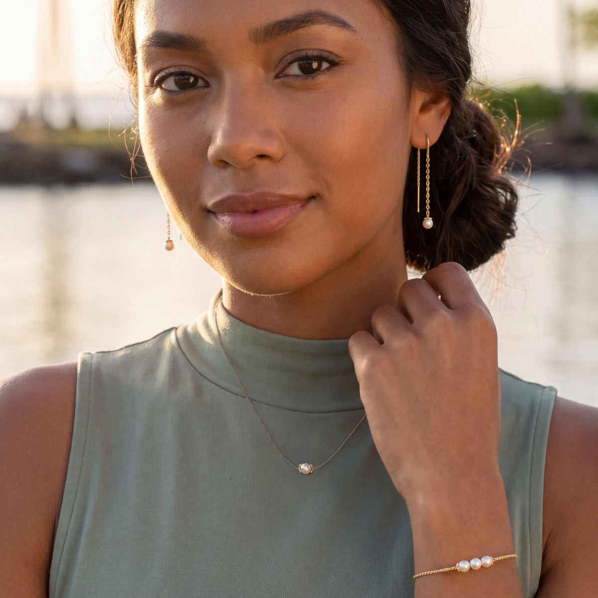 Model wearing yellow gold Pearl Flower earrings, necklace and bracelet Item No. 45446