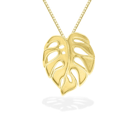 Close view of gold monstera necklace showing polished surface and organic leaf shape. Item No. 43748